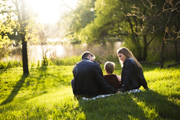 happy-parents-with-child-nature_23-2148201510